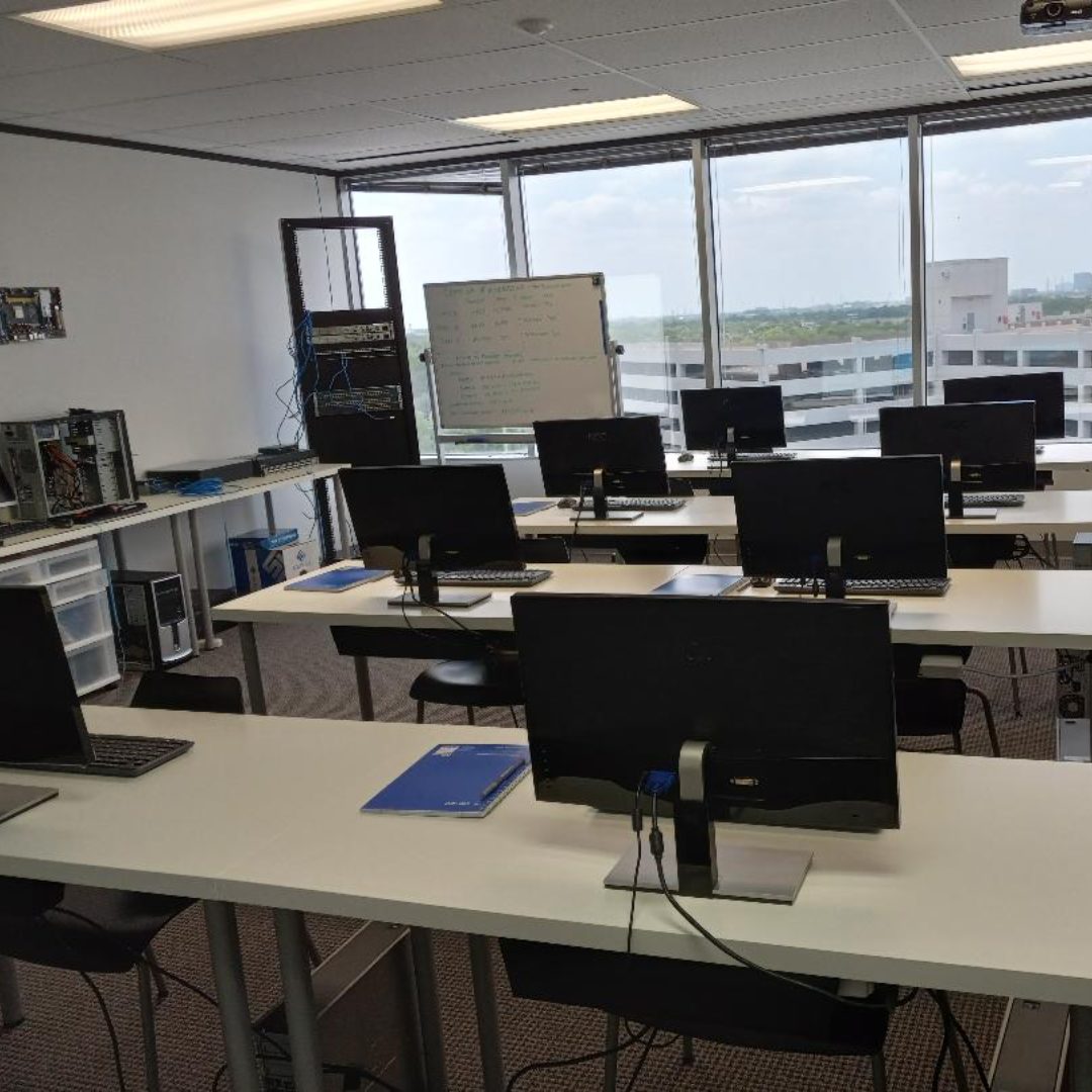 Instructor guiding students through network administration training